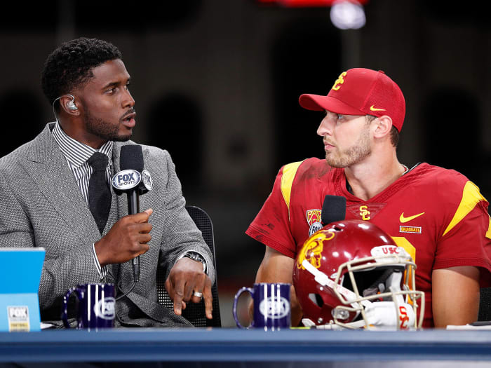 FOX Sports analyst and former USC star Reggie Bush interviews Trojans QB Matt Fink after the team's win over Utah.